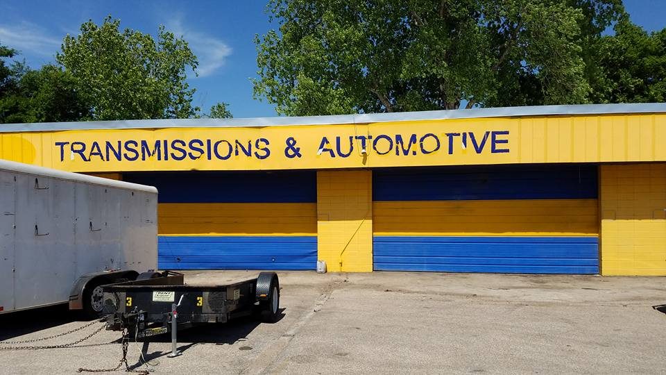 Before: unpainted shop exterior